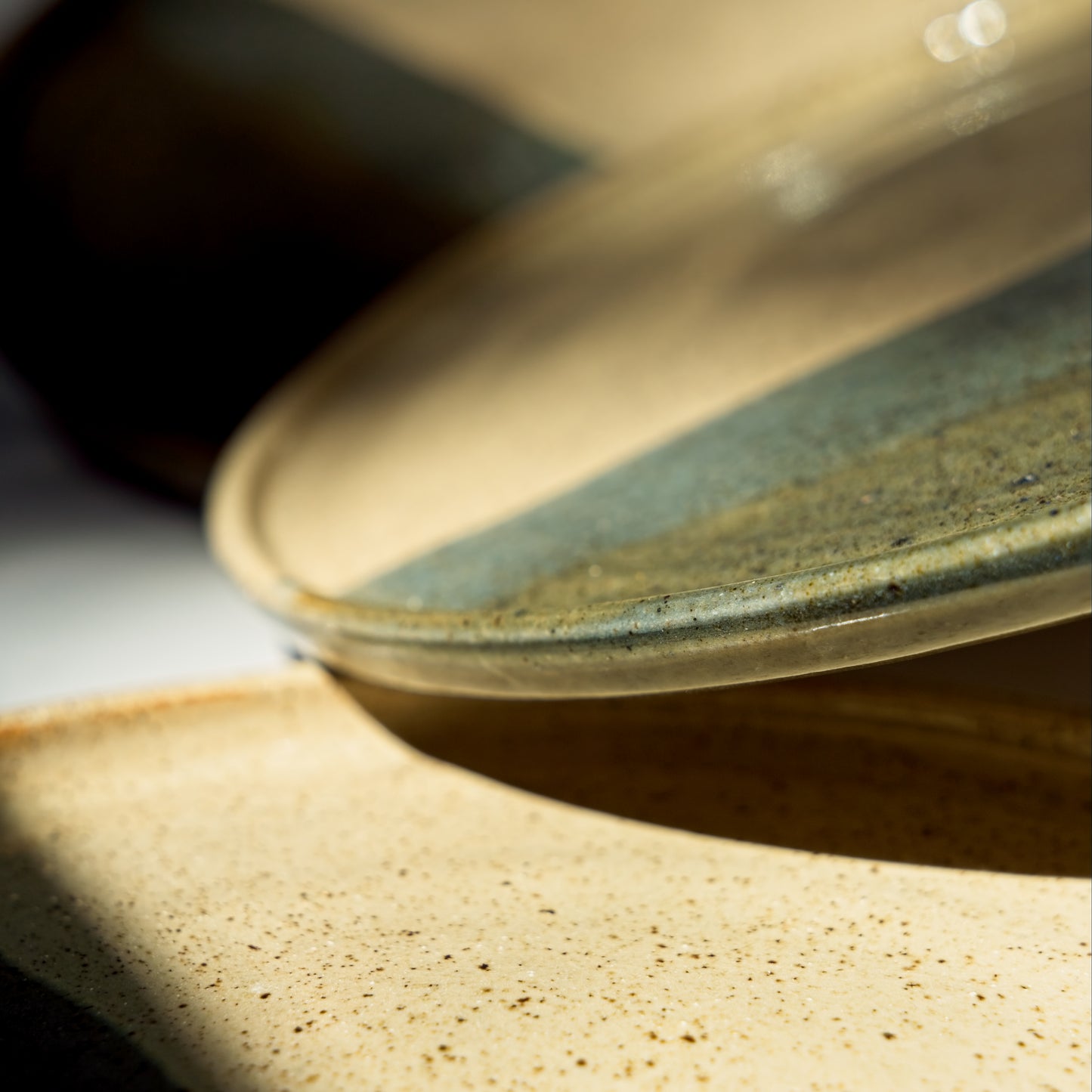 Close-up of a ceramic plate with a textured surface on a light background